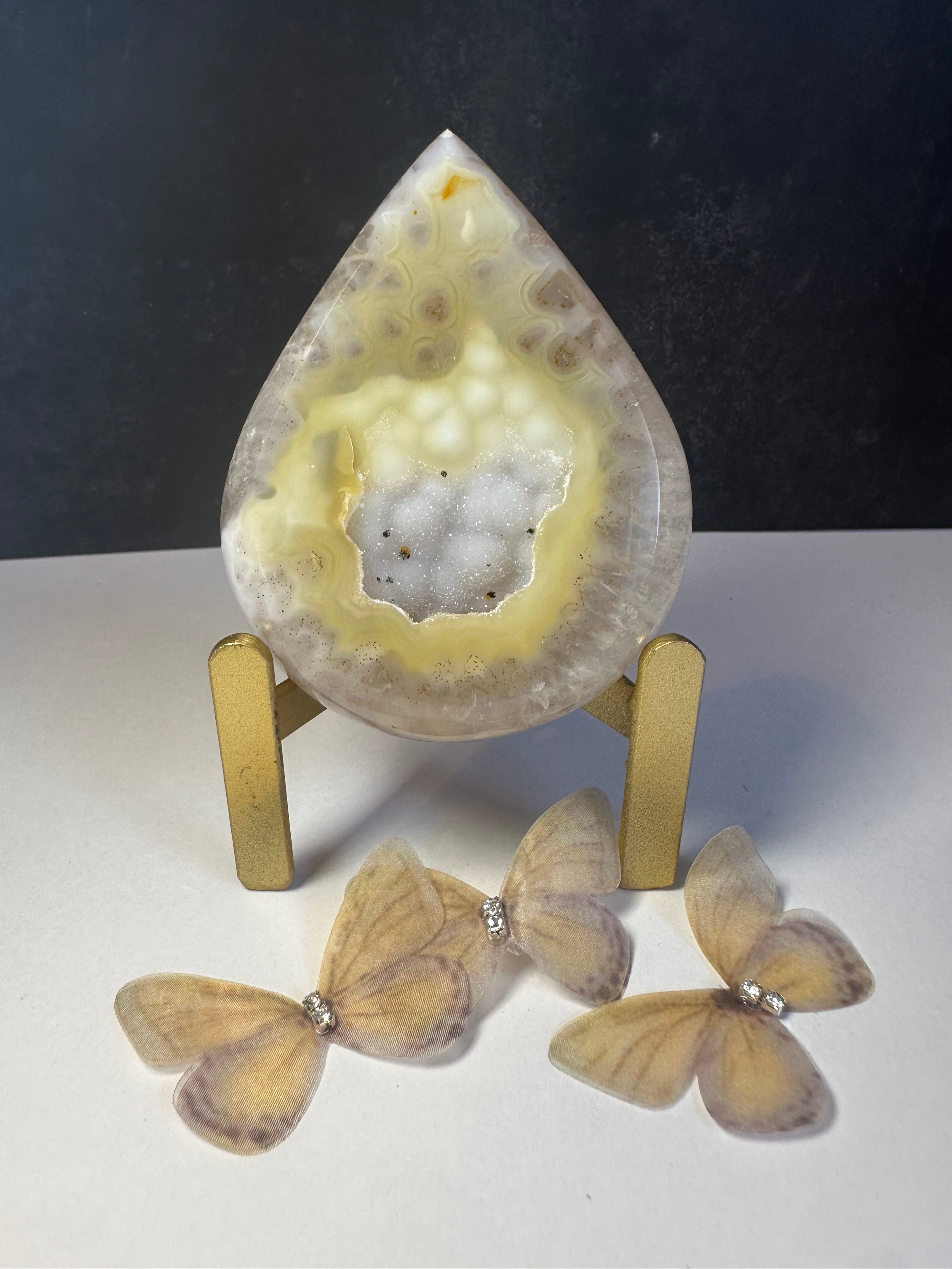 Gold agate tear drop on stand