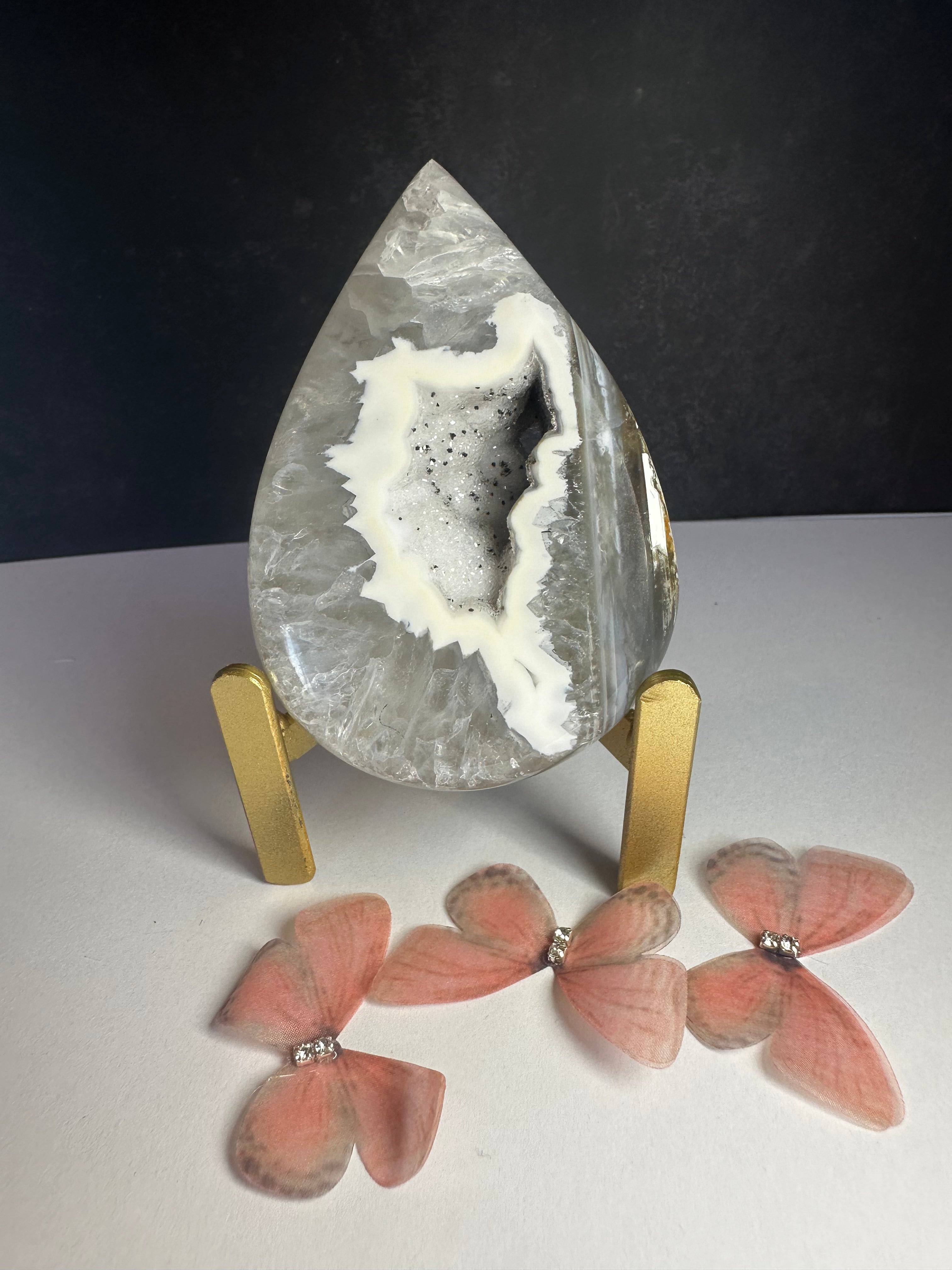 White/black agate tear drop on stand